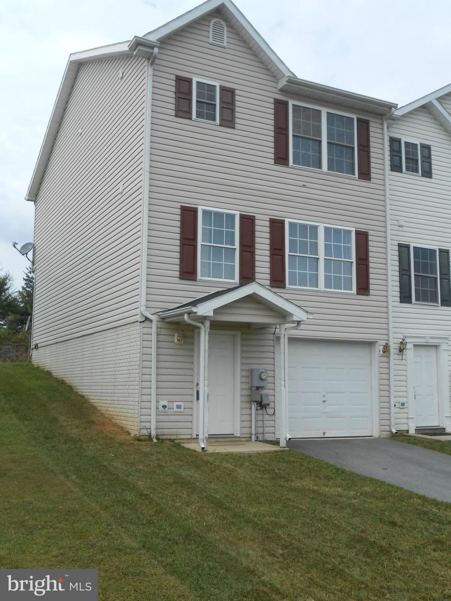 END TOWNHOUSE UNIT FEATURING 3 BEDROOMS, 2.5 BATHS, LIVING ROOM, DINING AREA AND EAT-IN KITCHEN. ROUGH IN BATH IN BASEMENT AND ONE CAR GARAGE.  IDEAL LOCATION BETWEEN MARTINSBURG & SHEPHERDSTOWN. GREAT RENTAL HISTORY. PROPERTY BEING SOLD "AS IS".CURRENT