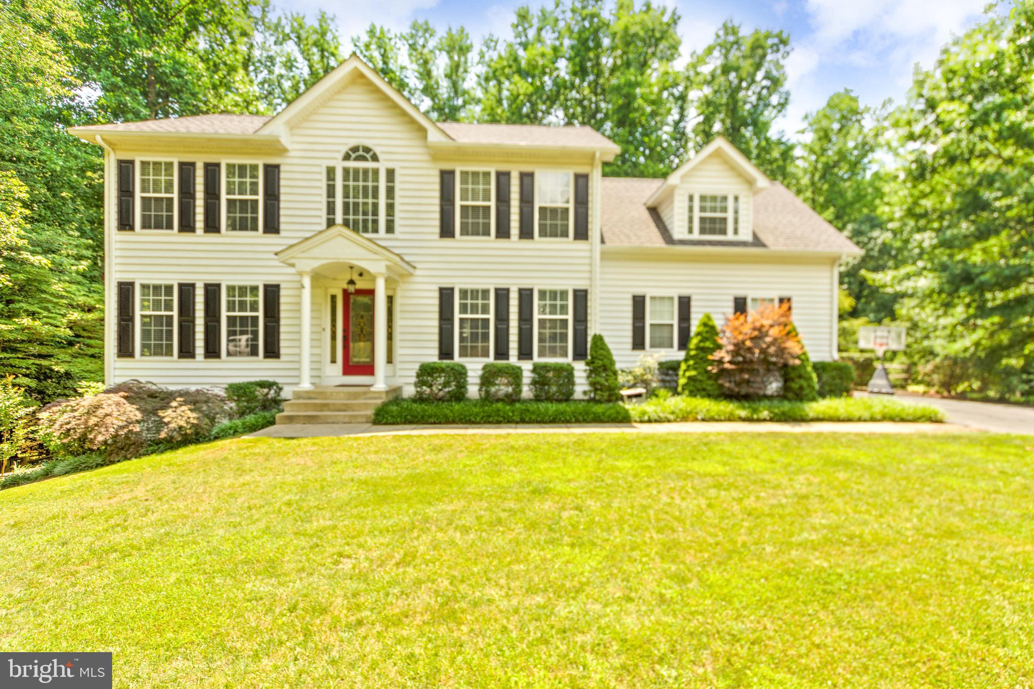 **PRICE REDUCTION** This is a stunningly beautiful house, in the coveted neighborhood of Walnut Creek, in Huntingtown, on an acre... what more could you want?!
The backyard is private, wooded, and heavily landscaped creating a park-like setting. The inside is exceedingly beautiful with an upgraded gourmet kitchen and check out the perfect size sunroom with the tongue and groove ceiling. Hardwood floors throughout too many upgrades to list, the house looks and feels beautiful. This will be someone's dream home. It could be yours but not for long, come see it before it's gone...!