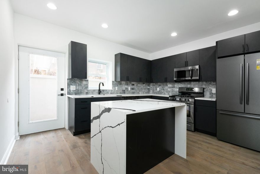 Welcome to 1830 Montrose St! This Massive 2300 sq ft, Newly Renovated 3 bed 2.5 bath townhome is now available to rent in a prime location in the highly sought-after Graduate Hospital neighborhood in Philadelphia. This home recently went under a brand new renovation with high end finishes. This spectacular home boasts 10 foot ceilings on the main floor, a cozy back yard space, Hardwood flooring throughout, a large eat-in kitchen with an island, Ultra contemporary custom black cabinets, High end black stainless appliances, Bentley Boss Calcutta Quartz countertops, Two Dual floating vanity bathrooms with floor to ceiling tile and Massive bedrooms. The 3rd floor master suite features a beautifully finished en suite master bath,  custom black walk-in closets as well as a large private rear deck. Easy access to Center City, Rittenhouse Square, and public transportation. Don't miss this great opportunity to live in this well-maintained, one of a kind home!