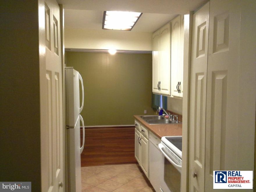 This adorable condo exhibits hardwood floors all throughout, spacious walk-in closets, open layout kitchen, and a beautiful bathroom with a tub in between. Full size washer & dryer located off side of kitchen. Great balcony over looking greenery. Outdoor property offers jogging path and close to Greenway Center and Greenbelt Park A great spacious place for anyone, don't miss out!Being in the Prince Georges County School District, the nearest schools are Magnolia Elementary School, Greenbelt Middle School and Eleanor Roosevelt High School. Restaurants and interstate malls are only minutes away. This one will go quickly in this condition and price!