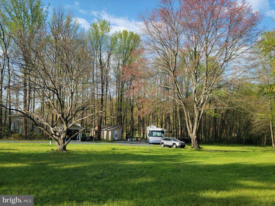 Large 2.42 Acre Residential lot in Aberdeen. Cleared camp/building site on lot surrounded by timber and natural landscaping. 300 ft Well and 200 amp Electric Service already installed. The 2 Sheds on lot will convey with the lot. Buyer to do their due diligence to confirm all septic, well and building information with the County. 
Conveniently located with easy access to 95, Route 40 and APG.