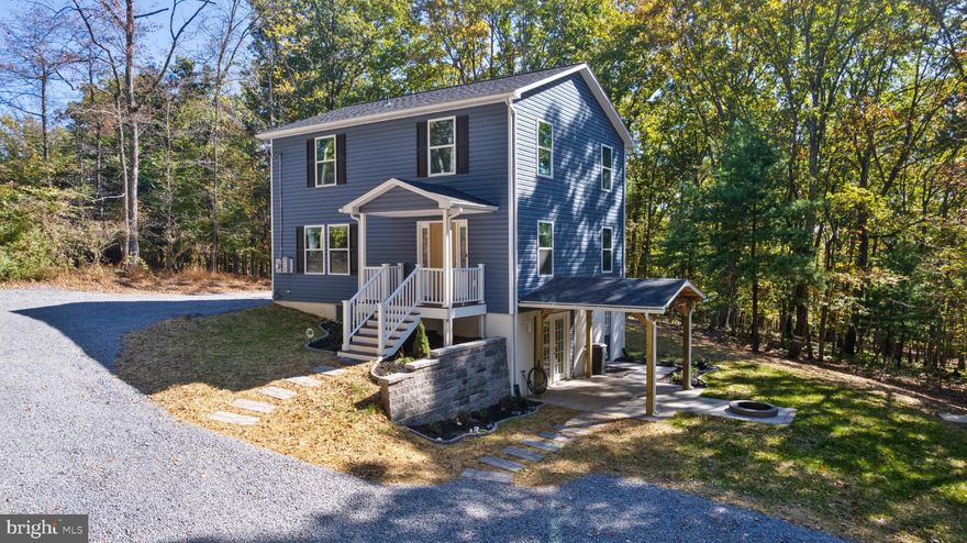 Situated on 1.5 secluded acres, this 3 bedroom, 2.5 bath home offers approximately 2,258 sq. ft. of finished living space. The main floor features an open concept layout combining the living room, dining area, and kitchen, along with a convenient half bath. The upper level features three bedrooms, including a primary suite with its own bath, along with a hall bath. The fully finished basement expands the home’s living area with an open, flexible layout. This home was taken down to the studs and rebuilt with all new electrical, plumbing, water heater, HVAC system and ductwork, insulation, windows, doors (except one), bathrooms, kitchen with Quartz countertops, appliances, roof, gutters, siding, etc. Outdoor features include a covered patio and fire pit area, ideal for relaxing and enjoying the private setting. Don’t miss this opportunity, schedule your showing today! Please use provided shoe covers or remove your shoes.