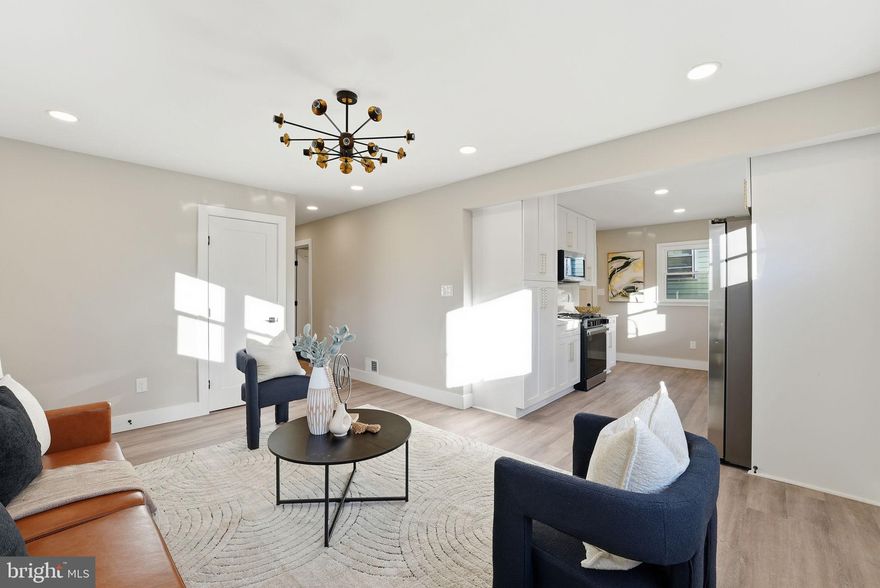 Beautifully renovated 5-bedroom, 2-bath home offering modern style, thoughtful craftsmanship, and turnkey living in the heart of Riverdale... Step inside to a bright and open living area featuring recessed lighting, wide-plank flooring, and a contemporary color palette that creates an inviting atmosphere for everyday living and entertaining. Large windows fill the space with natural light, enhancing the home’s clean, modern design... The stunning all-new kitchen is a true highlight, showcasing white shaker cabinetry, quartz countertops, a full quartz backsplash, brass hardware, and brand-new stainless steel appliances. With generous storage and prep space, this kitchen blends function with high-end style... This home offers five well-proportioned bedrooms, each with ample closet space—a rare find... Both bathrooms have been fully renovated with designer tile, modern vanities, stylish fixtures, and elegant finishes that create a spa-like ambiance for your daily routine... The exterior features fresh updates, a newly paved driveway, and a welcoming front entry. The location provides unmatched convenience—just minutes to shopping, dining, parks, schools, and major commuter routes with easy access to DC, College Park, and the Hyattsville Arts District... This home checks every box. Schedule your tour today—this one won’t last.