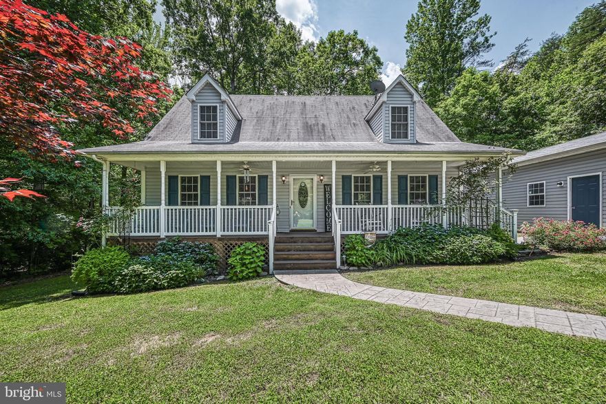 Welcome to Total Escape, located in the sought after Tall Pines subdivision on the public side of Lake Anna! This water access property sits on 1 acre and comes fully furnished, making it move in ready or a turnkey investment opportunity! The open main level floor plan is perfect for hosting, featuring a primary suite with seperate shower and soaking tub. Upstairs you will find two additional bedrooms, a full bath, and sitting area. Newly upgraded quartz countertops and a finished garage space designed as a fun family game room!
Step outside to your back patio for summer grilling or relax on your screened in porch. Take a quick golf cart ride to the waterfront common area, where you'll have access to a boat slip, ramp, beach, & pavilion. Prime location near local restaurants and wineries. Don't miss this chance to own your piece of Lake Anna living!