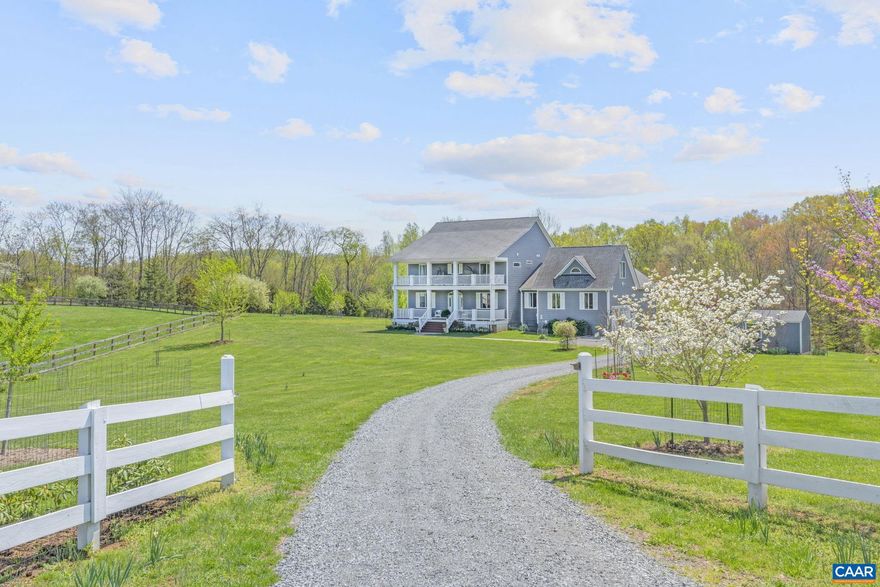 EXQUISITE CUSTOM HOME ON 6+ ACRES DESIGNED FOR SUSTAINABLE LIVING! Premier 2018 Custom home in sought-after Western Albemarle School District sits on over 6 acres in the desirable Western Albemarle School district and is now available for the first time to the market.    This property offers an ideal balance of luxury living and countryside charm. This thoughtfully designed residence offers two primary bedrooms with en suite bathrooms (main floor and upstairs) plus two additional bedrooms with en suites upstairs. Extensive covered porches front and back complement this country property featuring a pond backing onto 14 acres of conservation-protected woodland ensuring lasting privacy and tranquility. Home includes 28 solar panels powering family needs plus EV charging in the two-car garage. 22KV backup generator (2019), 3-zone HVAC & 500-gallon rainwater system irrigating garden and orchard.Fruit trees include pear, apple, cherry, plum, peach and fig. Established asparagus beds, berry bushes (blackberry, raspberry, blueberry) and optional chicken coop with two laying hens.Ample storage for recreational equipment with Beaver Creek reservoir minutes away. Perfectly positioned between Ivy and Crozet.,White Cabinets,Fireplace in Family Room