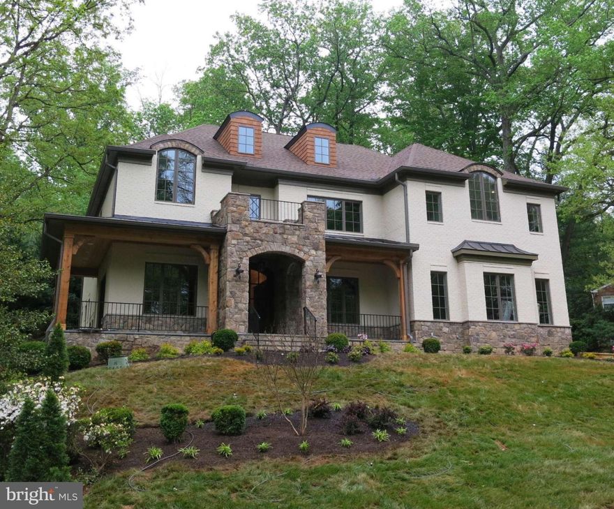 This fabulous new brick and stone beauty has been reduced!  Take another look at the quality and upgrades in this nearly 8,000 sq. ft. home.  It sits prominently on the lot with sweeping vistas from the front and side porches and has a very private rear yard surrounded by tall trees.  Easy commute to DC, Arlington and all airports.