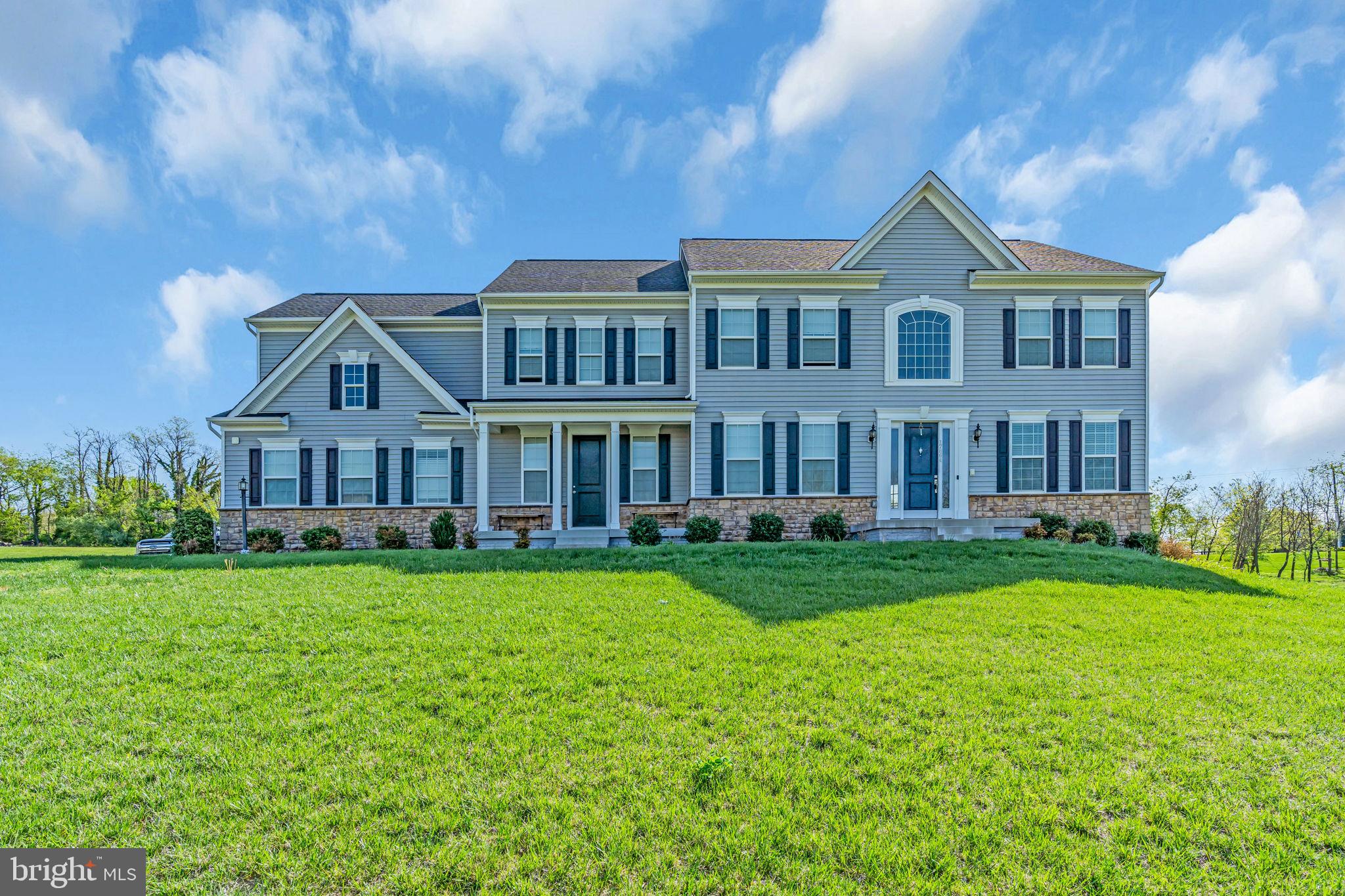 *****Price Improvement*****Welcome to this magnificent Craftsman-style estate nestled in the prestigious Jacksons Run community, surrounded by the picturesque rolling hills of Purcellville. This stunning residence boasts 5 spacious bedrooms, 4 full bathrooms, and nearly 5,000 square feet of refined living space above grade. The heart of the home is a gourmet kitchen, thoughtfully designed with custom quartz countertops, high-end stainless steel appliances, and seamless access to an expansive Trex deck—nearly 1,000 square feet—offering a breathtaking natural backdrop perfect for entertaining or relaxing. Rich solid wood floors grace the main level and staircase, leading into an immaculate two-story foyer and an elegant family room highlighted by a grand gas fireplace and soaring Palladian windows that flood the space with natural light. The upper level features a luxurious primary suite with a spa-inspired shower and two additional bathrooms, while the main level offers the convenience of a full walk-in shower in the powder room. Set on nearly two acres, this home also includes a side-load two-car garage, an extended driveway, and a stately portico entrance with a welcoming walkway. A truly exceptional property that blends timeless design with modern comforts—this home is a must-see.************ OPEN HOUSE **** Sunday August 17th 2-4PM*****