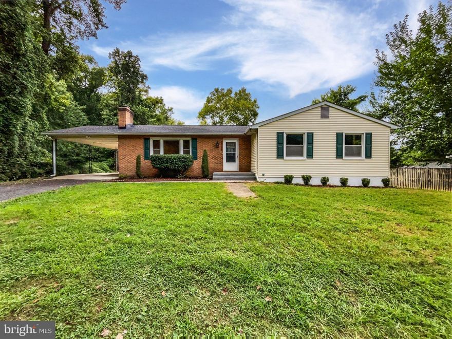 Seller may consider buyer concessions if made in an offer. Stunning interior updates set this 4 bedroom, 3 bath home apart from the rest. Step inside to fresh interior paint and updated flooring throughout, with a warm fireplace anchoring the main living space. The designer kitchen is the true showpiece featuring quartz countertops with a dramatic waterfall edge, stainless steel appliances, modern lighting, tons of cabinetry, and an effortless flow for entertaining. Retreat to the primary bedroom with a built-in closet system and private ensuite bath. Enjoy beautifully updated bathrooms with stylish finishes. The finished lower level expands your living options with a spacious rec room, a 4th bedroom, and a full bath—ideal for multi-generational living, or a private home office setup. Outdoor living is just as inviting with a large deck plus an adjacent patio space, perfect for grilling or gathering. This is a move-in-ready home where every detail feels elevated. 100-Day Home Warranty coverage available at closing