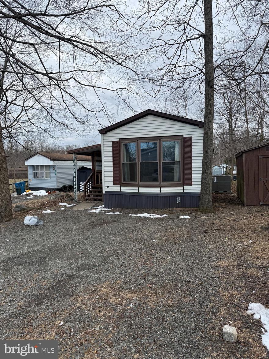 Don’t miss this well-maintained single-wide mobile home located in the desirable Richland Meadows community! This inviting home features cathedral ceilings and an open-concept layout, with an eat-in kitchen that flows seamlessly into the living room — perfect for everyday living and entertaining.  Enjoy the convenience of a full bathroom with in-unit laundry, complete with a separate full-sized washer and dryer. The spacious primary bedroom offers comfortable retreat space, while recent updates including a newer roof, new HVAC system and bathroom provide added peace of mind.  Step outside to relax on the covered front porch or entertain on the deck. A storage shed adds extra space for tools and seasonal items.  Lot rent of $655/month includes common area maintenance, lawn care, snow removal, water, and sewer — making for easy, low-maintenance living.