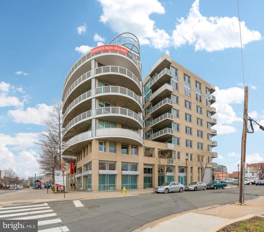 Airy and spacious top floor home. White quartz counters, stainless appliances, dark hardwood floors, gray contemporary cabinetry, floor-to-ceiling windows. Secure underground parking, lobby w/concierge, fitness center, rooftop deck, bike room, just steps to Clarendon and Ballston.