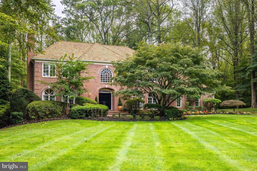 A Serene Oasis Just Minutes from Tysons!
Discover this lovely custom colonial nestled on a quiet cul-de-sac, offering over 5,000 square feet of living space and set on a lush, professionally landscaped lot. Backing to Bullneck Run parkland, this home feels like a private retreat. Enjoy breathtaking views of nature from every room, and relax or entertain on the expansive deck overlooking the pool and tranquil surroundings.
The main level features a welcoming foyer with an elegant curved staircase and rich wainscoting, leading to sun-filled formal living and dining rooms that boast floor-to-ceiling windows and a marble fireplace, perfect for hosting gatherings. The updated open-concept kitchen offers a center island with seating, a cozy breakfast nook with a bay window, and serene views of the backyard. Adjacent to the kitchen is a spacious family room with a stone fireplace and French doors opening to the deck. A handsome library with built-ins and a fireplace provides the ideal setting for work or relaxation. Additional conveniences on the main level include a powder room, a mudroom with laundry, a walk-in pantry, and a three-car garage.
Upstairs, the primary suite serves as a true retreat, complete with a fireplace, two walk-in closets, and an updated luxury bath with dual vanities. Three additional bedrooms, including one ensuite, and two more bathrooms provide ample space for family or guests. Beautiful hardwood floors extend throughout both the main and upper levels, enhancing the home’s elegance.
The walkout lower level offers an expansive recreation room with a gas fireplace, built-ins, and sliding glass doors leading to a flagstone patio. The lower level also includes a den/exercise space, a full bath, two large storage rooms, and a game closet. Outside, the fully fenced backyard is a private oasis, featuring a rectangular pool and a spacious deck perfect for formal or informal outdoor entertaining.
This exceptional home is located just minutes from Tysons Corner, with convenient access to the Capital One Hall Performing Arts Center, Silver Line Metro, and both Dulles International and Reagan National Airports. Outdoor enthusiasts will love being close to Scotts Run, Difficult Run, and Great Falls National Park for hiking and recreation.
