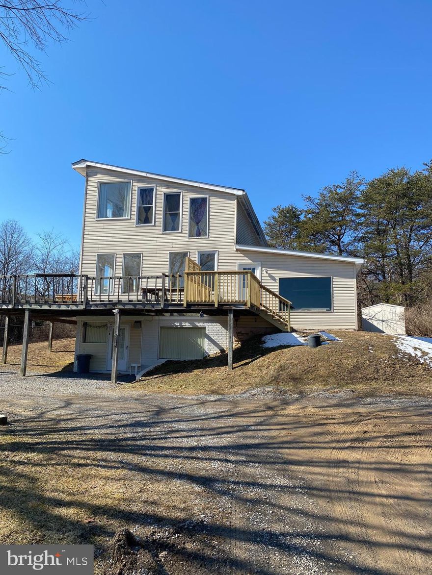 Large apartment with quiet, country setting.  Features open concept living with tons of natural light via large glass windows.  Features a garage with lots of storage.  Large loft bedroom with 2 baths.  Large tile flooring with laundry hookups also. Rent includes water, sewer, trash removal & electricity with a cap.