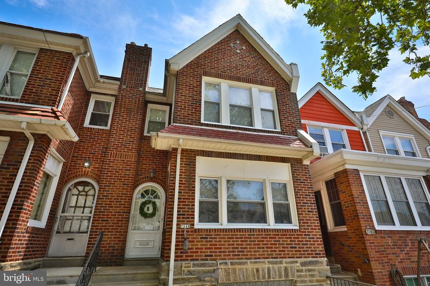 Welcome to this delightful Mayfair brick row home, featuring an arched front door and a cozy front patio, perfect for enjoying the outdoors. The first floor offers a formal living room adorned with elegant parquet hardwood flooring and neutral paint, complemented by an open staircase and two beautiful arched openings leading to the formal dining room. The kitchen is well-appointed with a stainless steel gas range, built-in microwave, dishwasher, stylish tile flooring, and a small counter with seating for two.
The second floor boasts three spacious bedrooms and a hall bathroom with a stall shower. The main bedroom includes a convenient powder room for added comfort. The finished basement offers additional living space with glass block windows and a separate laundry area complete with a laundry tub. (Basement toilet in inoperable) The basement also provides an exit to the rear driveway, one-car garage, and a fenced-in yard, offering both privacy and convenience. Don’t miss out on this charming home that blends classic design with modern amenities in the heart of Mayfair!