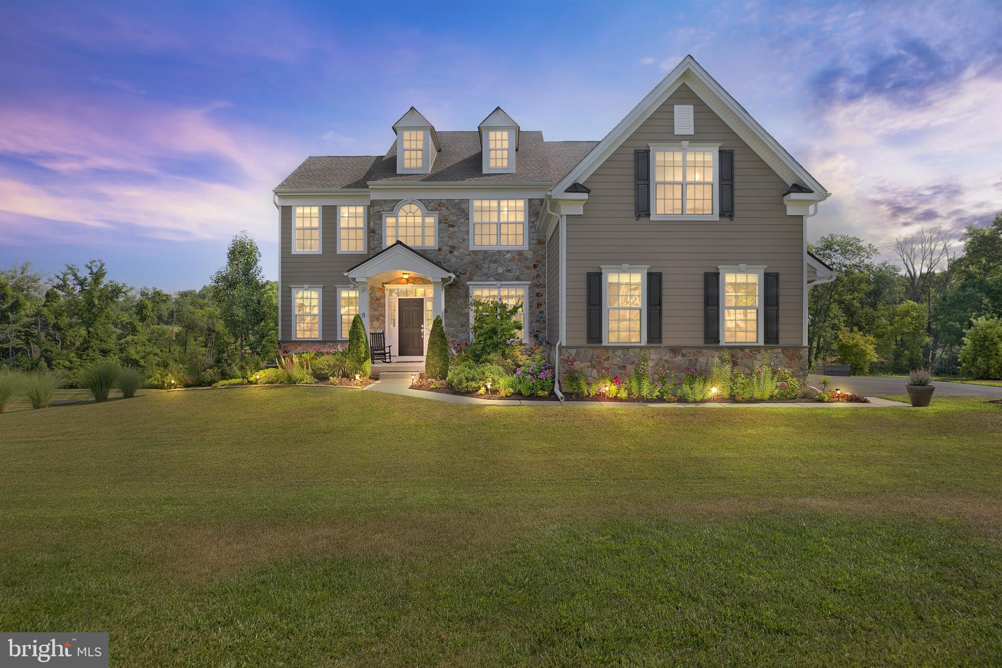 Welcome to this newly built home situated amongst the rolling hills of bucolic Bucks County. With over 3,000 square feet plus a finished basement and outdoor entertaining area, this expansive home offers the space to live the lifestyle you want. As you approach the home, appreciate the professional landscaping and pathway which leads to the welcoming entry with covered porch. Enter the foyer where you are greeted with hardwood flooring which flows throughout much of the space. High ceilings, expansive windows, and a neutral color scheme create an open and spacious feel. Flanking the entry, you will find a formal living room and a formal dining room. Continue to the heart of the home - the bright and airy kitchen and the inviting great room which offers a fireplace and views of your magnificent lot. The kitchen features high end fixtures, finishes, and appliances, including a double wall oven. The open flow of the home lends itself to entertaining both inside and out. From the kitchen, step outside to your expansive deck for additional entertaining space and to enjoy long distance views of the rolling hills. The finished walkout basement offers additional living and storage space and a full bathroom. Take the stairs up to the second level where you will find a spacious sun-drenched primary bedroom with a fireplace and generously sized ensuite bath with a large double vanity, soaking tub, and walk-in shower. Three other spacious bedrooms, two full bathrooms, and a convenient laundry room complete the level. Benefit from easy access to I-95, Philadelphia, Princeton, and NYC, while enjoying all of the charms of Bucks County living. Appreciate restaurants, shopping, and recreational activities in Newtown and surrounding communities. All of this plus the highly-rated Council Rock School District.