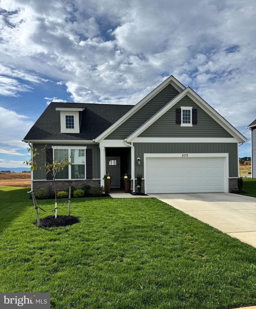 Welcome to your new home!  This cottage-inspired rancher is ideal as it provides main level living and a convenient second floor flex space of over 600 square feet that includes an additional 4th bedroom and bath! The spacious main level has a well thought out open floor plan setting for the dining room, family room, and kitchen and has 9ft ceilings and luxury vinyl planked flooring!  All the rooms have LED recessed lighting and are pre-wired for fans.  The dining area has a sliding glass door that leads out onto the large concrete 14 x 10 patio area. The nearby kitchen is complete with white Aristokraft self-closing cabinets, Whirlpool appliances, and white quartz countertops that include a large island with a deep stainless steel sink.  The master bedroom and bath are conveniently located on the main level as well.  The spacious master bathroom includes double-sinks with quartz countertops , vinyl plank flooring and ample storage.  The private toilet, walk-in glass shower, and large walk-in closet makes it a true master suite area. Nestled between the master closet and foyer area is the conveniently placed laundry room. The main level also includes two bedrooms and a full tub/bath shower. All the bedrooms have plush carpeting as well as the upstairs loft area. The 19x21  attached garage is WiFi-enabled and will easily fit two cars with room left over for your lawnmower and miscellaneous items.   Modern conveniences of this house includes Smart Home technology, keyless entry with deadbolt, video doorbell, and smart light switches.  This house includes curtains and hardware on the main level  and towel bars/rings in the bathrooms.  All the brand-new Whirlpool appliances in the kitchen convey. This home is move-in ready and waiting for you to call it home.