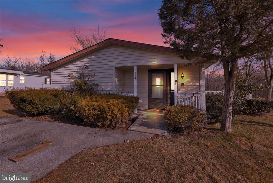 Welcome to easy one-floor living in this move-in ready home, offering comfort, convenience, and a low-maintenance lifestyle in a quiet neighborhood. The open living space makes it ideal for both everyday living and entertaining. The kitchen features plenty of cabinet space and the laundry is conveniently located just off the kitchen for added ease.
Recent updates include new flooring and carpeting, along with a newer roof and windows, providing peace of mind and modern appeal. Both the primary suite and the 2nd bedroom have private full bathrooms.   Step outside to a large deck that extends your living space outdoors—perfect for relaxing or entertaining. The spacious lot includes a storage shed, adding extra functionality. Affordable and inviting, this home blends practicality with charm.

Monthly lot rent: $750