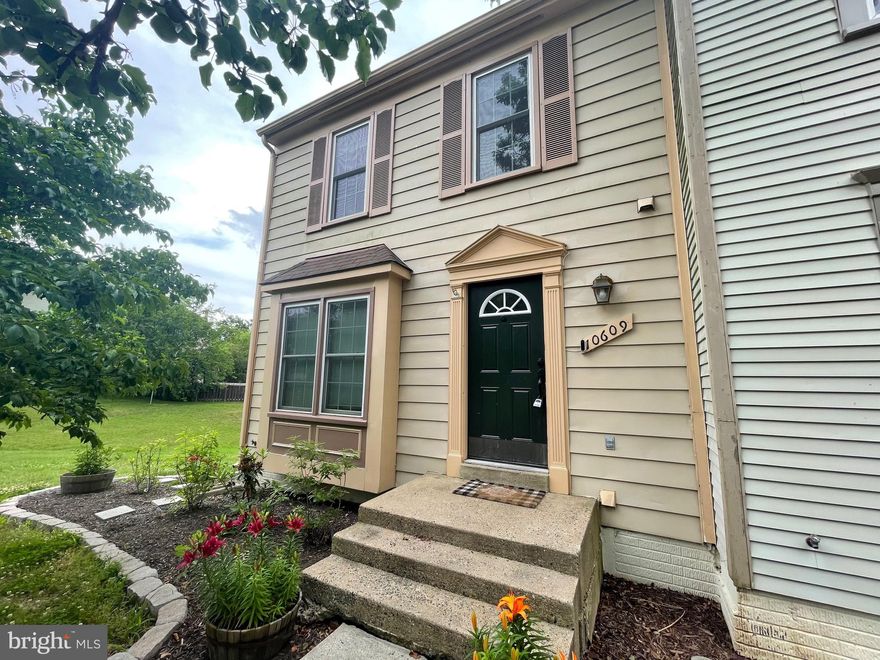 Gorgeous updated, end unit townhome.  Clean, renovated & ready for move in!  This gem features beautiful granite counters. stainless steel appliances.  Gleaming hardwood flooring throughout main level.  Peaceful deck, over looking large/ fenced back yard.  Lower level boasts additional room & full bathroom!  Walk out from basement to backyard.  2 assigned parking spots with visitor spots available.