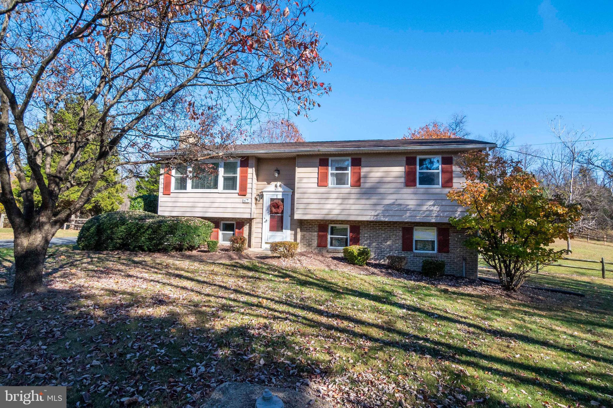 Well-maintained split foyer in the desirable river access community of Steamboat Run. This wonderful layout includes two primary bedroom options and two large living spaces to enjoy. The home is set on an acre of land in a tranquil neighborhood that provides river access and picnic grounds, providing a great balance of privacy and community. The home features three bedrooms, plus space for an in-home office or hobby room, and two full bathrooms. Each level has a cozy sitting area with the walkout basement featuring a propane fireplace. Great amenities continue outside with a second-story deck leading to a stamped concrete patio, a shed for additional storage, and split rail fencing securing the backyard with mature landscaping privatizing the exterior of the property. The home has been professionally painted and cleaned, ready for new owners to love. Don't miss your opportunity.