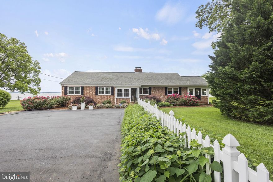 Welcome to the highly sought after GOLDEN COAST. Renovated waterfront property in Tappahannock on the Rappahannock River situated on 1.2 acre lot with your own private dock, boat lift & sandy bottom w/ bulkhead. Watch the sunrise on the water from your raised brick backyard patio! Water depth is 6-7 ft off dock. Newer detached 2 car garage with patio and long private drive. 4,356 sq of living space w/ hardwood floors throughout & beautiful fully finished basement, perfect for all your guests. Large living room with expansive river views and sliding glass doors leading to your patio as you walk out to the river, your firepit and your own Crab Shack. Features 2 fireplaces, built-in bookshelves, & recessed lighting throughout. Gourmet kitchen w/ granite counters, white tile backsplash w/accent tile, white shaker cabinets, a six burner gas stove, double oven, exhaust hood, breakfast bar at island, pendant lighting also w/water view! Elegant dining room w/chandelier & chair rail. Large sunroom w/ tiled floor, bead board ceiling & a continuation of the amazing view. Primary bedroom on main floor w/ensuite. Walk in shower tiled from floor to ceiling w/marble tiles, beadboard wainscotting, & pedestal sink. 2 additional bedrooms, tons of new built in cabinetry & chandelier. Charming hall bath w/bead board wainscotting, clawfoot tub & pedestal sink. Home office has built in cabinet w/shelves, & ceiling fan w/light. Oversized basement includes fireplace, wet bar, built in shelves & recessed lighting. Bathroom w/walk in shower, gray & white marble tile, floor to ceiling & single sink vanity. Additional bedroom in basement currently being used as a family room w/beadboard wainscotting, recessed lighting and closet. Boat lift weight limit 10k & house has 500 gal propane tank. Located across the street from the Rappahannock River Valley National Wildlife Refuge with countless trails, water access & minutes to shops, restaurants & more. Experience River living at it's finest & come tour this special property in person!