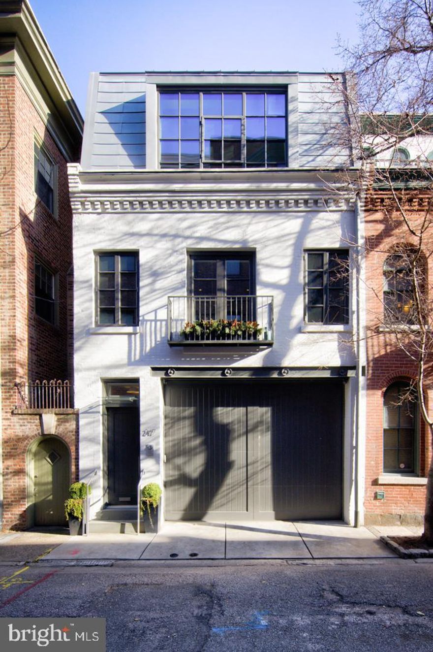 Tasteful, Elegant Carriage Home on a storybook block in Rittenhouse Square. Meticulous, thoughtful renovation that left no detail unconsidered. Tiled entry hall and full bedroom and bath suite on the ground floor. This flexible space is a wonderful guest suite or fold up the Murphy bed and use this area as a den or office. A garage with two car lift as well as plenty of storage completes this floor.
The second floor reveals the perfect entertaining space. This is truly a great room with wide plank white oak floors and dramatic oversized steel casement windows front and rear bathe this floor with light from its East and West exposures. True Chef’s kitchen features custom wood cabinetry, Honed superwhite quartzite countertops, Liebherr Refrigerator, 5 burner Bosch cooktop, Miele built in coffee system.
On the third floor is the primary suite with a large marble bath, soaking tub, frameless glass double shower, double sink vanity and radiant heated floors. The Bedroom has a built-in bed with night stands, a wall of custom cabinetry and a walk-in closet with full size stacking laundry. Access to the rear deck is at this level as well. The home has a sound system and intercom with video plus 2 zone HVAC. In addition to all the shopping, theatre and restaurants of Rittenhouse Square the property is 3 blocks to the Schuylkill River Park and Trail. Easy access to 30th Street AMTRAK station, Routes 676, 76 , 95 and the Philadelphia International Airport.