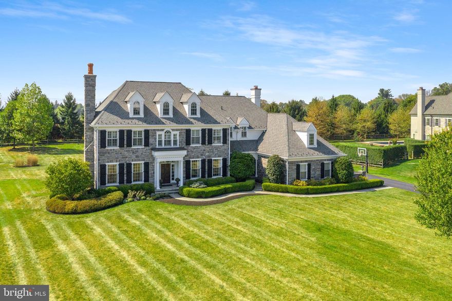 Introducing 6 Withers Lane in the desirable community of White Horse and Top Rated Marple Newtown School District. This magnificent 5 bedroom, 5.3 bathroom Stone Estate with oversized 3 car garage sits on a breathtaking 1.14 acre lot on a quiet cul-de-sac street. The interior offers dramatic 10ft ceilings throughout first level with a 12ft coffered ceiling in the family room. Five inch Brazilian cherry wood flooring graces the first floor while upgraded millwork and wainscoting greet you in all formal spaces. The living room offers a wood burning fireplace while both the professional office and family room have gas fireplaces. The family room is open to the focal point of the home- the incredible kitchen with massive marble island, custom cabinetry, commercial grade appliances, and attached breakfast room with vaulted ceiling and sliders to yard. The formal dining room is generous in size and has attached butler's pantry with inset cabinetry, sink and wine fridge- this house is an entertainer's dream!  This level is completed with mudroom area with built-in bookcase and double closets and formal and informal powder rooms.  The second level offers an incredible master suite with sitting room, his and her closets with built-in shelving, and luxurious master bathroom with double vanities, soaking tub, and stall shower.  There are 4 other ensuite bedrooms all with large closets, a laundry room with cabinetry and shelving, and an open space that is currently used as a homework area. The lower level is finished and offers additional living space, a half bathroom, and a professional style gym. The exterior of the home offers a huge, flat yard that backs up to 50 acres of farmland offering privacy and a flagstone patio- perfect for the upcoming warmer months.  All of this while being steps to Episcopal Academy, a short few miles to some of the best private schools in the country, minutes to Downtown Wayne and Paoli Train Station and close to all major roadways for an easy commute to Philadelphia, NYC, and Wilmington. Call today for your private showing; this house is not to be missed!