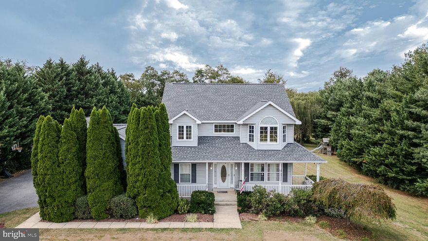 Come home to 367 Grouse Knoll Lane, Summit Point, WV! Nestled in the serene community of Quail Run, this exquisite colonial-style home offers a harmonious blend of elegance and comfort. The inviting front porch surrounded by mature landscaping is a cozy spot to enjoy morning coffee and watch the sunrise. The spacious interior boasts high-end finishes, including rich hardwood floors, crown moldings, and recessed lighting that create an inviting ambiance throughout. A formal living room with a gas fireplace and luxurious 9-foot ceilings adjoins the elegant formal dining room. The heart of the home features a well-equipped eat-in kitchen, which includes a gas range, dishwasher, and stainless steel refrigerator, seamlessly flowing into a cozy family room, perfect for intimate gatherings. A private office, half bath, and lofty foyer complete the main level. Retreat to the luxurious primary suite, complete with a walk-in closet and a spa-like bathroom featuring a tile shower with a bench seat. Each additional bedroom is generously sized, ensuring ample space for relaxation. The upstairs laundry offers convenience. The fully finished basement offers versatility, ideal for a home office or entertainment area, with LVP flooring, a full bath, and convenient outside access. Step outside to discover a beautifully landscaped 1.28-acre lot backing to tranquil woods, providing a private oasis. Enjoy outdoor living on the expansive deck or screened porch, perfect for morning coffee or evening gatherings. The property also features a built-in two-car garage and a 900-square-foot detached garage, for ample storage and parking options. With picturesque views of lush gardens and trees, this home embodies an exclusive lifestyle, blending luxury with the warmth of a true sanctuary. This meticulously maintained home was upgraded with a new roof with 30-year architectural shingles in 2021. Experience the perfect blend of sophistication and comfort in this remarkable residence.  367 Grouse Knoll Lane makes an excellent commuter location to the greater Washington, DC, and Northern Virginia area.