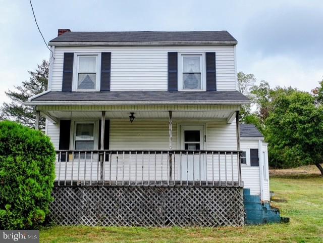 Sitting on 2.66 acres with beautiful views, this two-story home offers 3 bedrooms, 1.5 bathrooms, and plenty of potential. You'll find a cozy fireplace, an inviting front porch, a one-car garage, and an outbuilding for extra storage. The property has a well and septic, oil heat with a furnace less than 10 years old, a hot water heater around 3 years old, and a roof approximately 15 years old. The home does need some work, but with its country charm, solid features, and spacious setting, it's a great opportunity to make it your own.