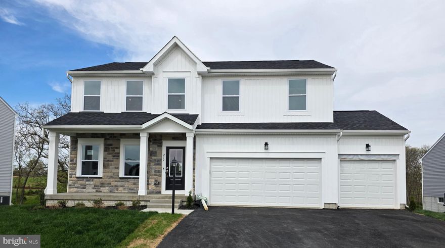 Spacious and beautifully upgraded Dallas floor plan featuring a full front porch, 3-car garage, and a sun-drenched morning room off the kitchen. The gourmet kitchen is equipped with upgraded cabinetry and countertops, perfect for entertaining, and opens to a large sunroom with access to a 10x18 deck overlooking a private, tree-lined backyard. The expansive primary suite includes a walk-in closet and a luxurious bath with dual vanity, linen closet, rain can shower head, and body sprayer. Three additional generously sized bedrooms, a hall bath, and a convenient second-floor laundry complete the upper level. The finished walk-out basement offers additional living space and a half bath—ideal for relaxing or hosting guests. Don't miss this move-in-ready gem!