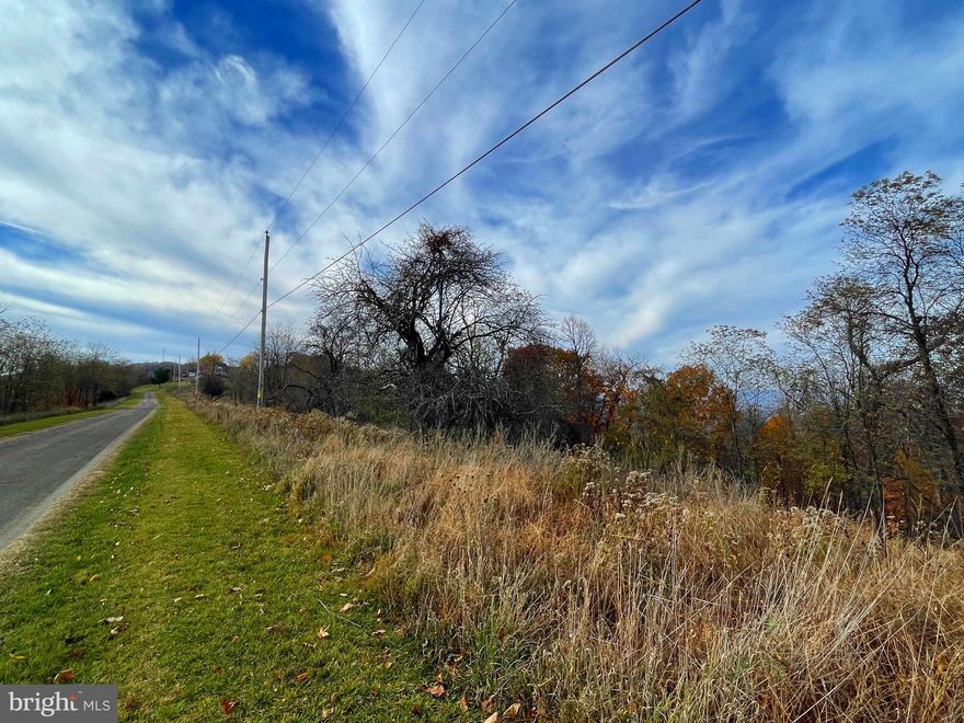 Lot with a view!  Just a short distance outside of Historic Romney WV and The South Branch of the Potomac River is "Applefields of Heaven".  Top of the mountain views!