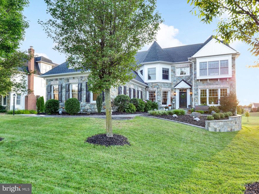 Fall in love with this gorgeous home in the Village of Waxpool - one of the most sought-after neighborhoods in Ashburn. This home offers a fantastic living experience for those who cherish family gatherings and entertainment.  It is a rare find with 6 bedrooms, 5 ½ bathrooms, and over 6500 square feet of living space. Upon entering the home, you will be captivated by the spaciousness, the stained-in-place hardwood floors, custom moldings, iron spindles on the staircase, and beautiful lighting. This home offers luxury living combined with "at-home comfort." The heart of this home is undoubtedly the recently updated kitchen, destined to be the hub of activity. With Quartz countertops, stainless steel appliances, double ovens, a five-burner cooktop, and a generously sized eat-in breakfast bar, it's a chef's dream. Adjacent to the kitchen is a breathtaking sunroom with windows, offering a relaxed spot for informal dining and seamless access to the rear deck. It is the perfect place to enjoy the tranquil backyard and catch the stunning sunsets. The expansive family room leads you to the "picture perfect" screened-in-porch with Tigerwood floors, angled ceilings, and a gas fireplace with a stone facade. When you are having a more formal celebration, you will love the elegance provided by the dining and living rooms. On the main level, there is also a private office, one of TWO offices making this home ideal for modern professionals.  

The upper level features a lovely owner's suite with TWO walk-in closets, a spacious bathroom with two vanities, a soaking tub, and a separate shower. Additionally, the second office is conveniently attached to the primary bedroom. Three more spacious bedrooms and two more bathrooms, one of which is an en-suite, are also found upstairs. For older children or guests, a fifth bedroom and fourth full bathroom await in the very private loft. There is no need to go far for clean clothes with a charming laundry room conveniently nestled between bedrooms. 

When heading downstairs, you will be transported to the entertainment center of your dreams with its custom bar, a spacious recreation room, a theatre room, and a gym with glass barn doors. The custom bar boasts glass shelves, fun lighting, draft taps, and ample seating. For additional living space, there is also a sixth bedroom and generously sized bathroom with a large shower and soaking tub perfect for long baths.

Walk outside to the stone patio, where you can unwind in the hot tub or enjoy outdoor games on the flat grassy lawn. Thoughtful custom outdoor closets help keep lawn items organized. The flat backyard is perfect for a future pool to complement the hot tub. The property also boasts a 3-car garage and a long driveway, providing ample guest parking. 

This community offers numerous advantages, including access to top-rated schools, nearby restaurants and shopping options, easy commuter access to major roads, and proximity to the upcoming Beaverdam Reservoir Park set to open in 2024 and is less than three miles from the Ashburn Metro stop. This stunning property offers a luxurious and comfortable lifestyle, making it an excellent choice for those seeking a spacious and well-appointed home in a fantastic neighborhood. Take advantage of the opportunity to call this beautiful property home!