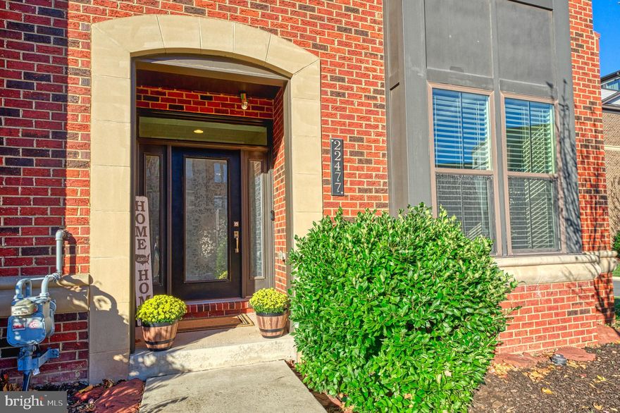Welcome to 22477 Foundation dr, Ashburn – a luxurious end unit town home, thoughtfully designed to provide every imaginable feature a buyer is seeking. Spread over 4 levels with nearly 3800 sqft and offering 5 bedrooms and 4.5 baths, this bright and spacious home will impress at every turn! 

As you step inside the home thru the front covered porch and into the lovely foyer, the main level offers multiple closets, a very generously sized bedroom suite with a walk-in closet and an attached, upgraded full bathroom plus a very rare mudroom with built in shelves and bench and access to the rear loaded 2 car garage. Ascend the stairs to the heart of the home and prepare to be wowed! Tall ceilings, fully open floor plan with gleaming hardwood floors, numerous windows on each end, a gourmet kitchen with a huge 13 foot island, tall cabinets, a walk-in pantry, a half bath, Nest thermostat and more! Plenty of space to spread out in the dining room and living room which comes with a gas fireplace. Enjoy access to the roofed deck off this level. The bedroom level offers 3 very generously sized bedrooms including a primary bedroom suite with 2 separate walk-in closets and a fully upgraded en suite bath with dual vanities with black granite countertop, chic tiles and a separate tub and walk in shower. In addition, there is a conveniently located laundry room on this level plus 2 additional large bedrooms and another full bathroom. Climb the stairs to the 4th level to reach the amazing rec room with access to the roof top deck! Enjoy the views of the community fountain from the 5th bedroom!  4th fully updated bathroom on this level. Enjoy the benefits of the infrared sauna located in the rec room – it conveys with the property! Enjoy the many excellent amenities this charming Westmoore community offers including a fitness center overlooking the pond, a dog park area and 2 community parks. The larger community park also has an amphitheater for summer concerts.  Resort style outdoor swimming pool, clubhouse with a caterer’s kitchen that can be rented for private family events and a great room. The Great room includes a gas fire place and  large screen TV’s. The vibrant community hosts many events and gatherings throughout the year including the popular Halloween parade.  Access numerous walking paths and trails both in and around the community. Some of the other outstanding features of this home include proximity to the Silver line Metro which is just a mile away! Dulles airport is only about 15 mins away. Plenty of shopping and restaurant options in the vicinty including the very popular One Loudoun area! The property is zoned to the top tier schools of Loudoun county! With so many awesome features to love, this home is a MUST-SEE! Come see it today and move in time for the Holidays!