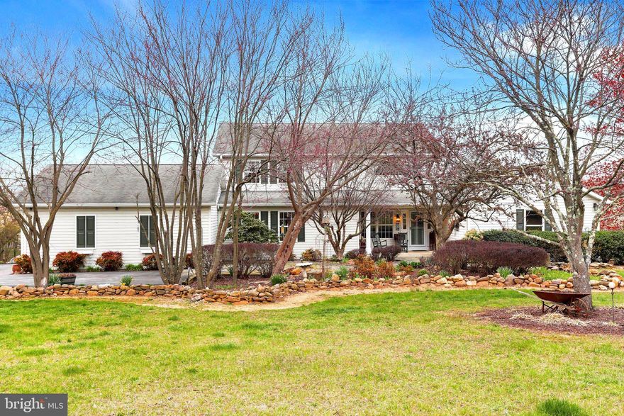 Beautifully  landscaped home on over 5 acres in a quiet, secluded community. This lovely home has river frontage on the Potomac! Did I mention you can have horses on this property? Yes, you can!
As you approach the home, you will find that it has a custom-laid stone patio edged with pretty perennials and shrubs. Gorgeous inside and out!
Enter into the entry hall with stained wainscoting and chair rail. The first floor has custom window moldings and sills trimmed with Adams trim and with custom crown moldings in most rooms. The huge great room has a floor to ceiling brick fireplace with woodstove insert and raised hearth.
The dining room with custom crown molding and chair rail has plenty of room for those big celebrations. The dining room windows are new in 2022.
The awesome-sized kitchen has been totally renovated. Note the double bowl sink and new faucet.
Granite counter tops grace all the surfaces. Look...cabinets everywhere!
In the Master Bedroom French Doors open to a private screened porch. The totally renovated master bath is a dream come true! Double bowl with vanity. Walk into an extra-large shower through a granite-trimmed arch. The shower is tiled in Tumbled Terrazzo marble floor to ceiling with a tile floor and ceiling. Jetted Whirlpool Jacuzzi tub has granite surrounds. A beautiful custom stone floor completes this one -of-a-kind bathroom.
The recreation room in the basement is a walkout to the lower deck. 
This home also has convenient central vacuum on all 3 levels!
With additional unique features that are too many to list. Come out and see them for yourself!
New Items:
Air Handler for AC/ Heating Unit 2022
Outside Compressor for AC/Heating Unit 2022
Dining Room Windows 2022
Office Double Hung Window 2022
Kitchen Casement window 2022
New Double Oven 2021
New Dryer 2021