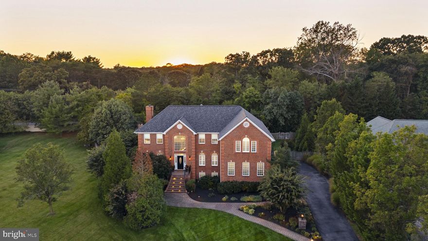 Welcome to 114 Longfellow Drive in the highly desirable Brittingham community, served by Severna Park
schools. This stunning 5-bedroom, 4.5-bath residence is tastefully updated, offering luxurious amenities and
exceptional indoor/outdoor living for both everyday comfort and grand entertaining. A long private driveway
leads to this elegant brick home, highlighted by paver walkways and wrought iron railings. Inside, a
dramatic two-story foyer showcases both the spacious living room and formal dining room, creating an
inviting and open introduction to the home. The remodeled chef’s kitchen boasts custom cabinetry, GE
Monogram appliances, an oversized granite island with seating, and a walk-in pantry, while the two-story
great room impresses with soaring ceilings and custom windows. A cozy family room, complete with
shiplap-accented wall and gas fireplace, provides the perfect retreat for everyday living. Upstairs, the private
primary suite features vaulted ceilings, dual walk-in closets, and a beautifully remodeled spa-inspired bath
with a soaking tub, quartz double vanities, and a custom-designed shower. Three additional bedrooms and
two full hall bathrooms provide generous space for guests. The fully finished English basement offers
multiple recreation areas, a custom bar, gas fireplace, and a guest suite with full bath—an ideal space for
entertaining and relaxation—while providing ample storage throughout. Step outside to your backyard
paradise, a true entertainer’s dream. Enjoy a heated 28,000-gallon saltwater pool, hot tub, waterfalls,
multi-tiered Ipe deck, and a fully screened cabana with stacked-stone woodburning fireplace and outdoor
kitchen with granite countertops, natural gas grill, refrigerator, and sink. Professional hardscaping, paver
walkways, irrigation, and custom lighting enhance this private, fenced oasis. The community of Brittingham
offers easy access to the paved B&A Trail, perfect for scenic bike rides or walks, with a route that extends all
the way south to Annapolis. Kinder Farm Park is also nearby, with convenient, safe access across Jumpers
Hole Road thanks to recently installed pedestrian-activated safety lights, ideal for biking, walking, or
attending sports and recreational activities. With a side-entry 2-car garage and an unbeatable location just
minutes from Annapolis, Baltimore, Washington, and major commuter routes, this home masterfully
combines luxury, functionality, and timeless appeal. Don’t miss your chance to own this extraordinary
Brittingham residence!