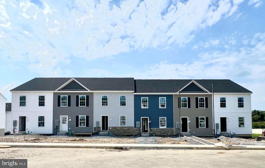 Immediate delivery.
Located next to the Jefferson County Line but with Berkeley County prices! Builder offering 3% in closing costs! 3-story townhouse with 3 beds, 3.5 baths, and 1,944 sqft. Middle level features family room, kitchen, dining area, laundry room, half bath, and pantry. Upstairs has 2 primary bedrooms with en-suite bathrooms and walk-in closets. Basement includes 3rd bedroom with walk-in closet and full bath, a large rec room, and ample storage. Home has granite countertops, soft-close cabinets, LVP flooring in living area, carpet in bedrooms, walk-in shower in primary bedroom, and a walk-out basement.