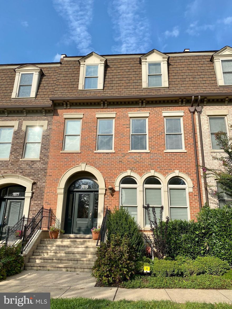 Remarkable Mitchell & Best  custom home located in the desirable Maple Lawn community offering modern style and sophisticated design. Adorned with gleaming hardwood floors, beautiful molding, recessed lighting, soaring ceilings, oversized sunbathed windows and an amazing open concept. Brand new carpet and fresh paint throughout. Prepare delectable dinners in the stunning kitchen, complemented with granite counters, 42" cabinetry, gas cooking, oversized island, walk in pantry, and a casual dining area. The adjoining family room provides the ideal place to relax and unwind in front of the warm fireplace overlooking the deck.  Ascend upstairs to a sprawling master suite featuring dual walk-in closets, sitting area, and a luxury master bath highlighting separate vanities, a glass enclosed shower with seating, and a divine soaking tub. Continue up to the next level to find an inviting loft or second family room, three generously sized bedrooms and a full bath. The lower level offers a den and recreation area for additional living space providing a total of almost 5000 square feet of total living space.