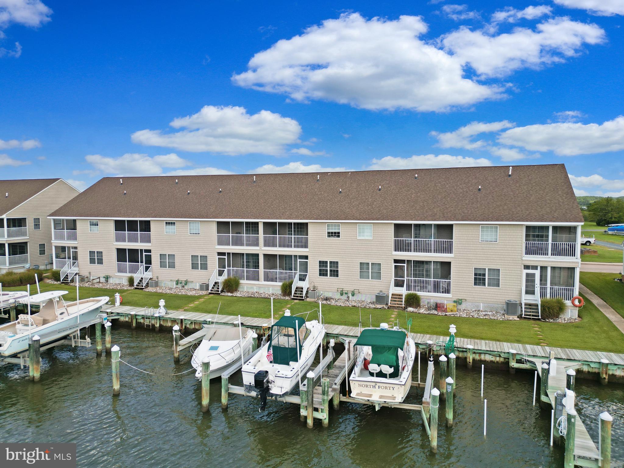 Sit back and relax and watch the beautiful sunsets in this well-maintained, barely used, 4 bedroom 3 full bathroom townhouse style condo located in the golf-cart waterfront community of Crisfield, MD. If sitting indoors isn't for you, grab a beach towel and sit on the nearby sandy beach or enjoy the community pool right outside your front door. Relax in 1 of the 2 enclosed porches and watch the boats go by on the Little Annemessex River which flows into the Tangier Sound or walk right out to your very own included boat slip with lift and ride off into the sunset on your own boat. Whether you are looking for a place to retire, a second home, or a permanent residence, this waterfront condo in this waterfront community is the perfect place to call Home.