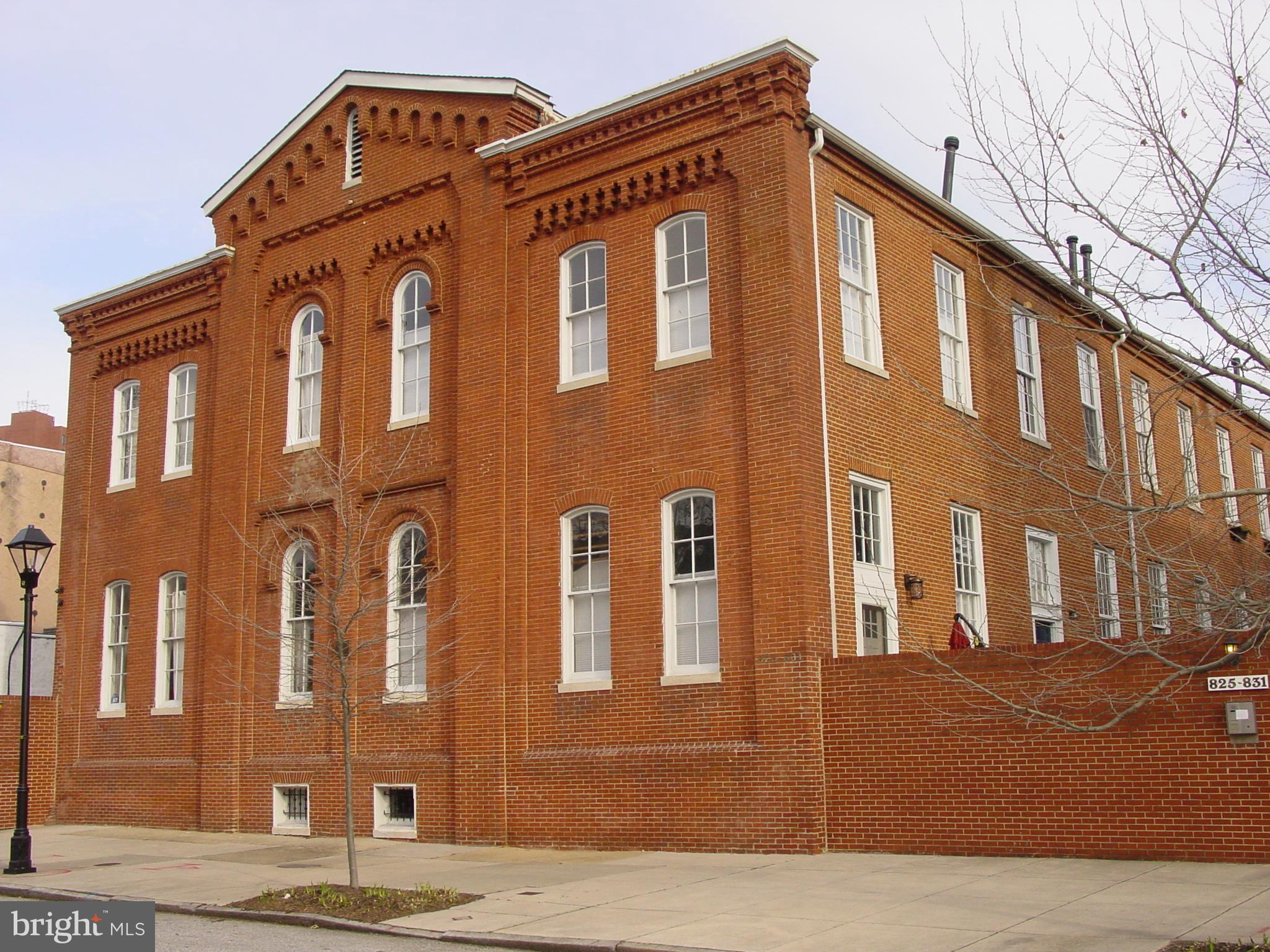 3% BUYER CLOSING HELP WITH ACCEPTABLE CONTRACT..Interesting 1860 School House Conversion to Condo's. ASSIGNED Off Street Parking! Wonderful 12 foot Ceilings on both the main and upper levels! Huge bright windows. Living Room with Fireplace! Both Bedrooms have attached full baths plus main level Powder Room! Hardwood Floors thru out! Fresh paint and new carpet. Full basement. Tidy front yard! Wonderful school house charm! Neat front yard and secure gated entry. Easy to show!