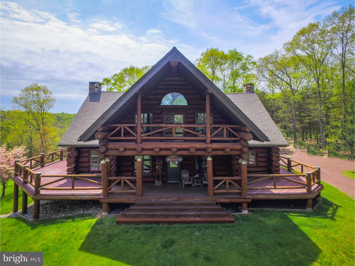 Magnificent, Spectacular, Amazing. These are the words to describe this truly unique custom crafted Home. Constructed from Hand-Hewn Douglas fir logs, assembled in Montana and relocated to this premium location in Tinicum Township, Bucks County. The hilltop home features an open floor plan encompassing the modern kitchen, dining and living spaces wrapped around a custom open staircase and anchored by a stone fireplace reaching up to the 22 ft. vaulted ceiling. You will feel instantly comfortable surrounded by warmth of glowing natural wood. Numerous windows and decks surrounding the home offering a seamless transition to the outdoors. Three bedrooms and three full baths along with walk in closets provide plenty of storage. The house is suited for expansion to accommodate a new owner's desires. The full unfinished walkout basement can be finished into bedrooms or entertainment area. New roof, 2 new air conditioning units, trex deck along with numerous improvements to minimizing maintenance. The beautiful 26 acre wooded property also includes a guest or rental cabin. It is a short walk to Delaware River and Delaware state park. Two scenic streams, mature woodlands and a rolling landscape contribute to the private and serene environment of this exclusive property. The upper Delaware River is replete with eclectic dining and shopping options. The property is easily accessible from either New York City or Philadelphia.