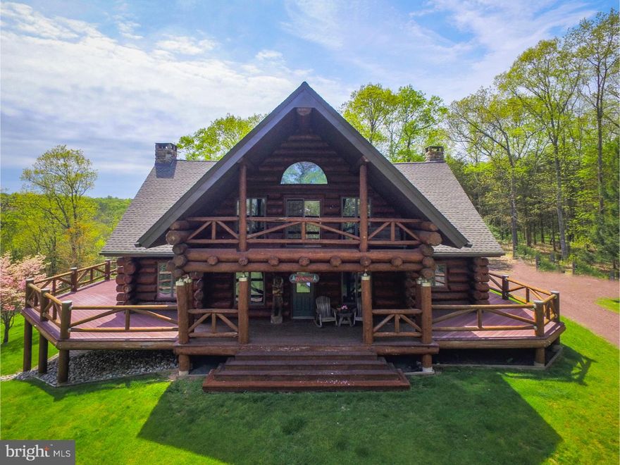Magnificent, Spectacular, Amazing.  These are the words to describe this truly unique custom crafted Home.  Constructed from Hand-Hewn Douglas fir logs, assembled in Montana and relocated to this premium location in Tinicum Township, Bucks County. The hilltop home features an open floor plan encompassing the modern kitchen, dining and living spaces wrapped around a custom open staircase and anchored by a stone fireplace reaching up to the 22 ft. vaulted ceiling.  You will feel instantly comfortable surrounded by warmth of glowing natural wood. Numerous windows and decks surrounding the home offering a seamless transition to the outdoors. Three bedrooms and three full baths along with walk in closets provide plenty of storage. The house is suited for expansion to accommodate a new owner's desires.  The full unfinished walkout basement can be finished into bedrooms or entertainment area.  New roof, 2 new air conditioning units, trex deck along with numerous improvements to minimizing maintenance.  The beautiful 26 acre wooded property also includes a guest or rental cabin. It is a short walk to Delaware River and Delaware state park. Two scenic streams, mature woodlands and a rolling landscape contribute to the private and serene environment of this exclusive property. The upper Delaware River is replete with eclectic dining and shopping options. The property is easily accessible from either New York City or Philadelphia.