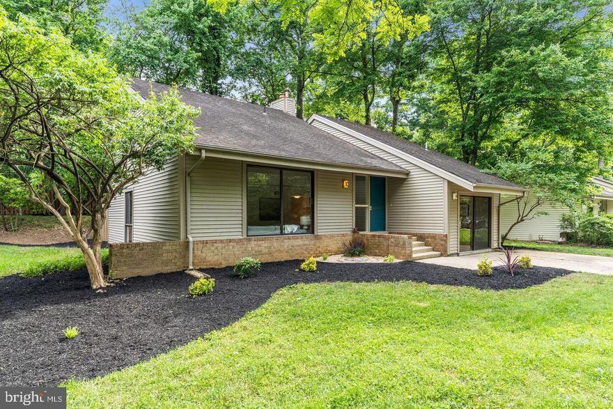 STUNNING MID-CENTURY MODERN GEM IN SERENE NEW MARK COMMONS! Discover the perfect blend of historic charm and contemporary living in this rare, timeless mid-century modern home nestled in the serene community of New Mark Commons in the heart of Rockville. This planned community, designed by builder Edmund Bennett and architects Keyes, Lethbridge & Condon, offers beautifully preserved natural surroundings, and a unique living experience with an array of amenities. The neighborhood's historical significance was recognized with its listing in the National Register of Historic Places in 2017. Set on a premium cul-de-sac lot, this sparkling updated 2 level, 4BR 2.5BA home highlights an exciting open floor plan with soaring ceilings, abundant natural light, and an airy living/dining area with vaulted ceilings . This gem also features a large versatile space, converted from the garage, ideal for a main level suite, home office, studio, or gym. Conveniently adjacent to this space is the laundry and storage room. An inviting family room with a fireplace and sliders to the patio, and a spacious bright kitchen with resurfaced white cabinets, view of greenery through the sink windows, and shining new appliances round out the first floor. On the second level sits the primary suite with a dual-door en-suite bathroom connecting to a second bedroom, and a hall bath shared by the 3rd and 4th bedrooms. Stylishly renovated bathrooms and powder room, brand new stainless steel appliances, new HVAC, NEW hot water heater, NEW ROOF! Fresh paint throughout, professional landscaping, and lovely curb appeal make this home truly stand out! Take advantage of the extensive community amenities, including a beautiful lake, swimming pool, 2 tennis courts, a basketball court, clubhouse, bike paths, and tot lots. All this within just 0.5 miles from Rockville Town Center and the Metro station, or one block from the Ride On bus to Rockville Metro, and easy access to I-270, Rockville Pike, and Pike & Rose.