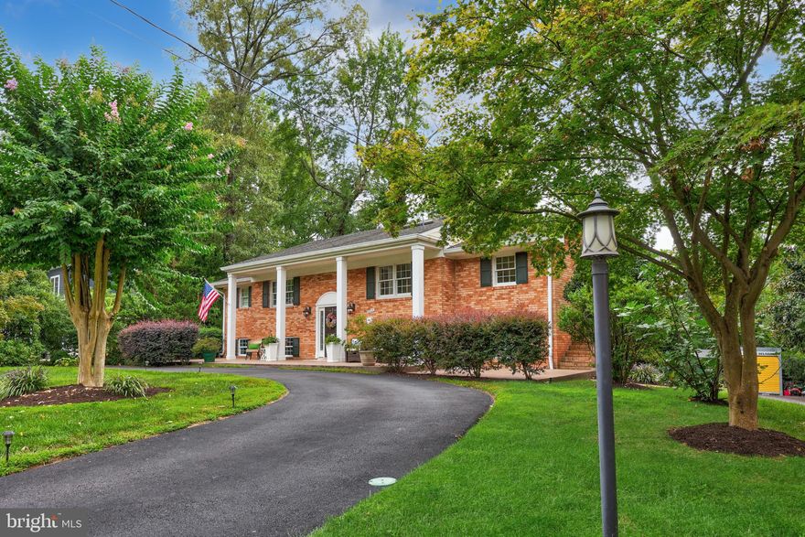 Introducing a lifestyle crafted with enduring design, convenience, and a coveted Yacht Haven address with an opportunity to assume a VA loan at 2.25%  This 4,260 square-foot residence balances scale with warmth, offering 5 bedrooms and 4 full baths across two spacious levels. With its open flow from the great room to the expansive back deck, the home was designed for gatherings, connection, and everyday ease. Rich Brazilian cherry hardwoods pair with elegant ceramic tile on the main level, where a private primary suite "wing" becomes a retreat of its own. Complete with a bonus office/study/nursery, deck access, and even a dedicated washer/dryer, it brings an elevated level of convenience. An additional bedroom and bath, a welcoming dining area, and a kitchen-to-living layout complete this floor. The lower level extends the lifestyle with a second family room, its own entertaining kitchen, three additional bedrooms, and two more bathrooms—retreating outdoors to a large covered patio and a beautifully landscaped, hardscaped yard. Storage is not in short supply thanks to two backyard sheds, while the rear-load garage adds flexibility for parking, a workshop, or a home gym. Eye-catching curb appeal begins with a newer paved circular driveway and a stamped concrete front porch perfect for crisp fall evenings with a mug in hand. Behind the beauty, modern efficiencies ensure confidence: a whole-house generator, tankless water heater, dual HVAC systems, and an additional mini-split for comfort in every season. Set within the sought-after Yacht Haven community, this property offers a unique advantage: no HOA restrictions, yet access to the exclusive Mount Vernon Yacht Club membership—where non-residents often wait years to be able to apply. Located just minutes from Fort Belvoir and major bus routes, Mount Vernon is also home to Fort Hunt Park, and the historic Mount Vernon Estate.  A home with these thoughtful details just might be the one you’ve been waiting for!