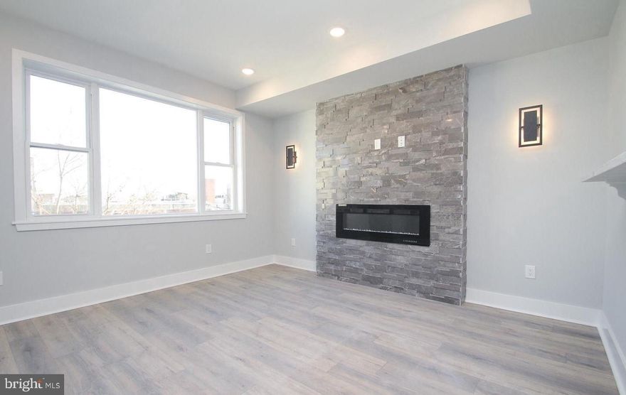 Right in the heart of all the excitement that Fishtown has to offer, this beautiful 1 year old 2br/1ba pet friendly apartment now available on Frankford Ave. Located on the same block as  Philadelphia Brewery, Atlantis Bar, and Flow State Coffee, also just around the corner from Martha bar as well. Only a few blocks from public transport and a Subway stop. Unit comes completed with luxury engineered wood floors and a fireplace with decorative tiled accent wall in the living room. The open kitchen has quartz counter-tops and bar height seating, furnished with stainless steel refrigerator, built in microwave,glass top range and garbage disposal. Large windows fill the space with light and there are ample closets throughout. The unit also has stackable washer/dryer and intercom system. This is a non-smoking building. Tenants responsible for $50 monthly water bill.