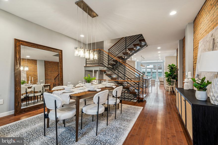 Welcome to 724 S 15th Street! Nestled between Bainbridge Street and Fitzwater Street is this one-of-a-kind, fully renovated 4-bedroom, 2.5-bath home, where historic charm meets modern comfort. This property was meticulously rebuilt in 2014—preserving only the original exterior marble steps and front brick wall, which has been beautifully repointed to maintain its classic appeal. Expanded to a full three stories with a fully dug-out, finished basement and new roof deck, this home offers exceptional space and thoughtful design at every turn.

Enter the home to a beautiful dining room area adjacent to an open concept kitchen and living room. A powder room is tucked in by the switchback stairs, which allows for convenient access from both the basement and main floor.
The modern white kitchen was designed with an abundance of storage (the convenient pantry has slide out drawers), and hosts an 8’+ island for plenty of seating, and a minibar fridge beneath the wine racks for easy guest entertainment. The living room, however, steals the show with the electric fireplace, soaring ceiling with chandelier, and two story floor to ceiling windows that open to the private rear space. This oversized parking spot has plenty of room for 1-car, as well as a grill/bikes/strollers, or even a small sitting space.  When you’re ready to wind down and turn in for the night, the motorized blind allows for total privacy. 

The SECOND floor has two bedrooms and a full bathroom with a tub and two sinks.  The laundry closet with side by side front loading washer and dryer is thoughtfully located in the hallway on this floor.  The THIRD floor boasts a true primary suite with a large bedroom, oversized walk-in closet, and spa-like 4 piece bathroom with an extra large soaking tub for two, glass shower, private toilet area and double vanity.  The fourth bedroom is also located on this floor.  Step up to the FOURTH floor where the fiberglass roof deck is with beautiful unobstructed city skyline views and a wet bar on the landing at the top of the interior stairs. There is a fully finished LOWER LEVEL that is perfect for a home gym, playroom, storage and more!  Situated in a lively area, the residence is conveniently close to Rittenhouse Square, Broad Street, CHOP,  UPenn, Target, Sprouts, and numerous dining and café options. Public transport is easily accessible, making this more than just a home; it's a lifestyle. Don't miss the opportunity to live in one of Philadelphia's most desirable neighborhoods.

Floorplans and origina construction plans available