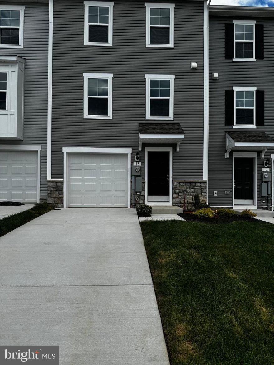 DRB Homes Overlook at Riverside - Next to Children / Dog Park - Brand New Town Home 4 Bed Rooms, 3.5 Bath, Upon entry of this wonderful townhome, a finished rec room (can use as a 4th Bed Room) with a full bathroom. The main level offers luxury vinyl plank flooring throughout and a spacious living room with a powder room. The eat-in kitchen features an island, Quartz countertops and stainless steel appliances. The spacious primary suite features a generous walk-in closet and an en suite bath with a dual sink vanity and an oversized seated shower. Two secondary bedrooms & full bath, a linen closet and a centrally located laundry complete the upper level! Set in a wonderful new community, Dog Park, Children's park, Basket Ball Court, Tennis Court, and Recreation sit up area are free amenities. In a prime location for I-81, Rt 11, I-70 commuters, mountain views, walking distance to shopping, and restaurants, access to Spring Mills schools, and close to interstate just minutes from the MD line. This rental may not last long.