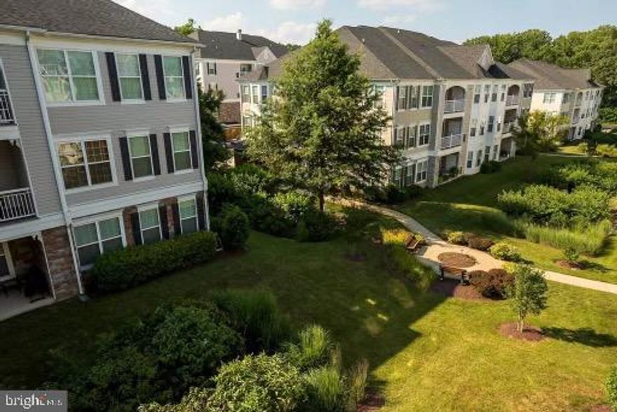 Beautiful, centrally located, 55+ community offers a super 2 bed 2 bath rental! A coveted unit with it's own garage and balcony. You will love the ease of  acess to all major routes, community pool and so much to do in this community.  This unit is open, bright and wooden floors in main living area. Available Oct 1 2021. Would consider less then 12 months.