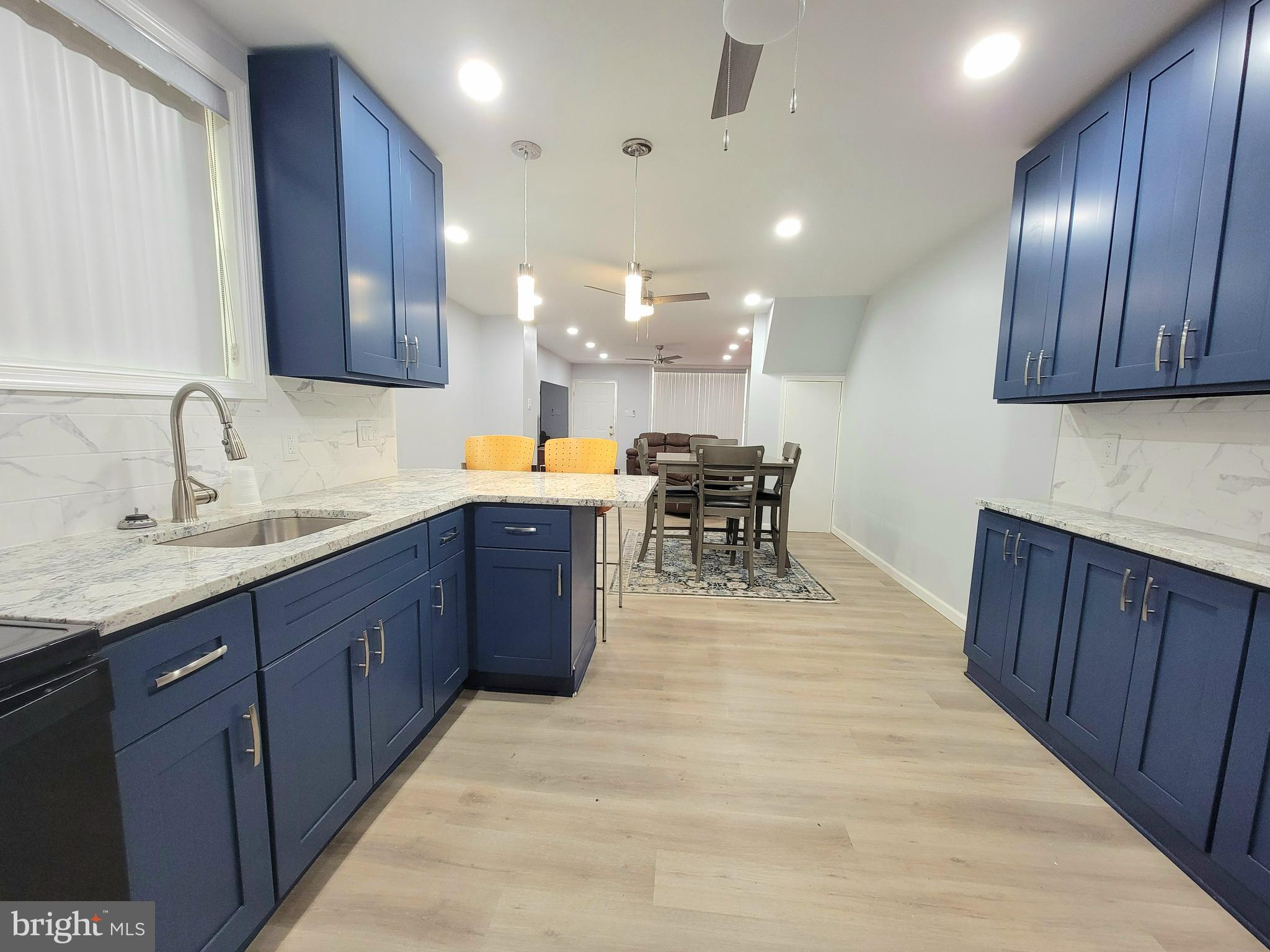 Welcome to 5928 Sansom Street in West Philadelphia — Where Style, Comfort & Convenience converge.
Step inside this fully renovated West Philly gem and feel the energy shift. Every inch of this 3-bedroom, 1.5-bath beauty has been thoughtfully transformed to give you the sleek modern lifestyle you deserve, without sacrificing the character that makes city living magical. From the moment you enter, you're greeted by an open-concept layout that flows effortlessly from the sunlit living room to the designer kitchen. Your eyes are drawn to the rich red exposed brick that climbs the staircase wall—a bold, urban statement against a crisp palette of light gray walls and warm luxury plank flooring.
The chef-inspired kitchen is a showstopper, featuring navy shaker cabinets, sparkling granite countertops, stainless steel appliances, a marbled tile backsplash, floating pendant lights, bar seating, and an eat-in dining area. Whether you're meal-prepping, hosting friends, or just enjoying a quiet coffee, this space works as hard as it wows.
Each of the three large bedrooms offers plush upholstered bed frames, full matching dressers and nightstands, work-from-home stations, individual remote-controlled, mini-split A/C & heating units, wall-mounted flat screen TVs, and soft, contemporary colors to suit every vibe. The main bath is spa-inspired with a walk-in shower wrapped in marble-style tile, built-in shelving, modern fixtures, and accessibility grab bars. The half bath on the main level adds an urban edge with its exposed brick accent wall and clean finishes.
The freshly sealed basement offers a blank canvas for storage, a future rec room, or a creative studio. 200 amps are already in place, giving you enough juice to power all your electrical needs. The new, private fenced-in backyard, with freshly poured, new concrete is low-maintenance, and perfect for relaxing or entertaining. The covered, enclosed front porch adds curb appeal and extra chillaxing space that feels connected to the neighborhood.
Additional features include an in-unit washer and dryer, brand new windows and flooring, updated systems throughout, and move-in-ready condition that makes it easy to start anew. (This home has also been Section 8 approved, so if you are an investor looking for a turn-key property to start, or add to, your portfolio, this could be the one for you.)
Located in the heart of West Philadelphia, you are surrounded by culture, connectivity, and community. Walk to Malcolm X Park, hop on the Market-Frankford line, or explore the 52nd Street corridor full of grocery stores, shops, and local eateries. You're just minutes away from major universities like University of Pennsylvania & Drexel, Center City, CHOP, University City and green spaces, making this location ideal for convenience, lifestyle, and long-term livability. Don’t miss your golden opportunity—schedule your showing today!