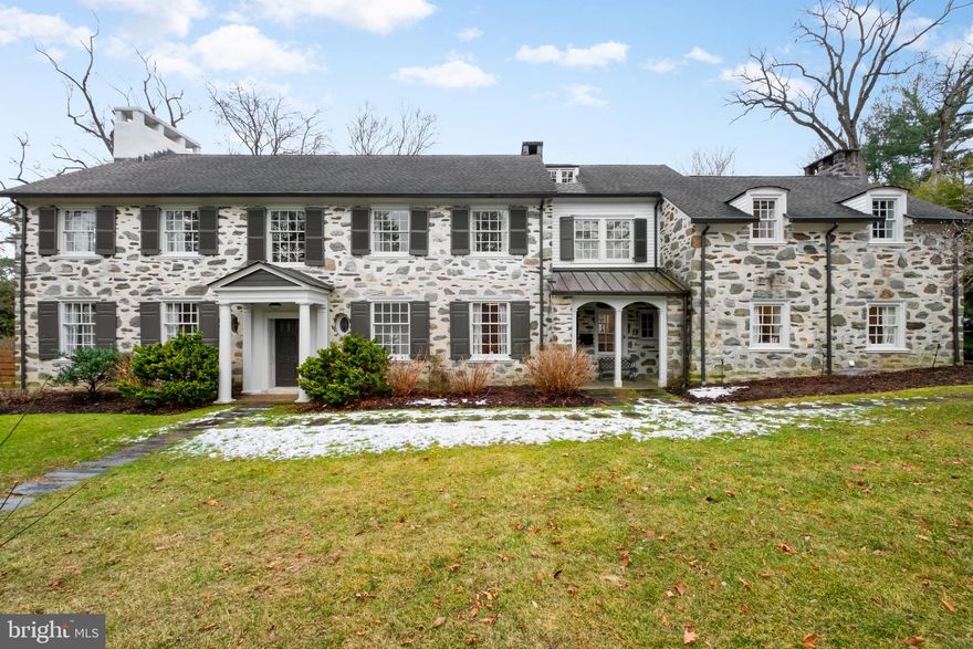 Welcome to 422 Warick Rd in desireable Wynnewood.  Good architecture can add to the way that we feel.  In this case, the flow of this Wallace and Warner 1926 beautiful stone home, the scale of the rooms, the preserved original architectural details, high celings, flood of natural light, it all works beautifully. Set back from the street, the porched entrance welcomes you into a double height foyer with marble floors and impressive original staircase. Explore the first floor layout room to room with ease. First enter the spacious living room with a wood burning fireplace and patio doors to the garden, pass the home office/den/powder room to enter the large dining room, great for winter holidays by the fire, then proceed to the gourmet kitchen.  The eat in kitchen offers space for a dining table and chairs in addition to the breakfast bar. It is conveniently located with entrances to the  huge pantry/laundry room, a door to the front porch  and secondary entrance and one to the patios and pool.  The kitchen is nicely appointed with custom cabinets, upscale appliances, quartz countertops, marble backsplash and heated slate floors.  The laundry room/pantry has a second convenient powder room and interior access to the garage.  The second floor includes 6 bedrooms, all of great size with ample storage and 4 full bathrooms. The primary suite is a dream with a private roof deck, amazing bathroom  and 2 walk in closets.  There is a Junior Suite with en suite bathroom.  The remaining 4 beds and 2 bath as you proceed down the hall.  The attic level has  been finished to include a family room,  sauna, large bedroom and full bath.  It also has  a small room currently used as dry storage but easily converted into another office/den if needed.  This home has been loved and meticulously renovated throughout the last 13 years.  In 2024 solar panels and  2 batteries plus 3 heat pumps were installed. There is an electric car charging station. It has been beautifully landscaped and completely fenced in. The flagstone patio is great to BBQ by the heated saltwater pool.  Plenty of additional yard space left to kick the ball and run around.  It is conveniently located to major roads and public transcportation. Walk to shops and  restaurants, including Whole Foords and Suburban Square.  Situated in the Lower Merion School District this home has it all! Seller is a Realtor. Professional exterior photos coming soon!