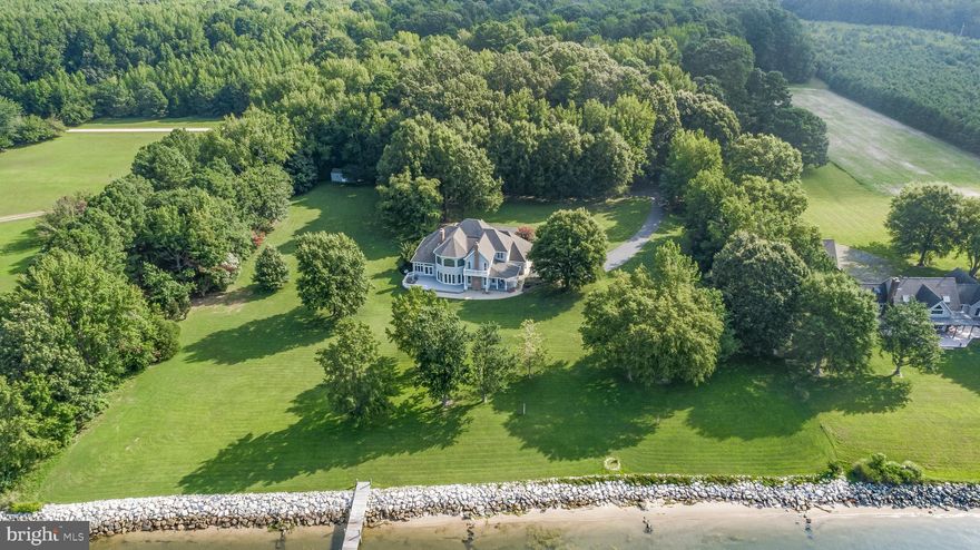 Once in a Lifetime Potomac River Estate on 20+ Acres

At the end of a long, private drive, discover this breathtaking custom-built Potomac River waterfront 3459SQFT Colonial, nestled on 20.35 acres of pristine land with sweeping river views and a private pond. Built in 1995 by its original owners, this stunning 4-bedroom, 2.5-bath estate redefines timeless craftsmanship, luxurious design, and absolute privacy.

The main level boasts soaring 10-foot ceilings and a primary bedroom with panoramic water views and a spa-like bath featuring a custom-made vanity by renowned craftsman Pat Woodburn. From the dramatic curved staircase imported from Milwaukee to the handcrafted maple cabinetry and heart pine coffered ceilings in the kitchen, every detail was designed to impress. The gourmet kitchen features top-of-the-line GE Monogram appliances, including a built-in 48” refrigerator, induction cooktop, and double ovens—framed by solid maple custom Pat Woodburn crafted cabinetry and bathed in natural light.

The family room stuns with a floor-to-ceiling stone masonry fireplace spanning 2 floors, a wet bar, and direct water views! Both the parlor and hearth room are also equipped with custom brick fireplaces. Entertain in style with the ample sized formal dining room accented by a solid brass chandelier.  
Upstairs offers three generously sized bedrooms, a full bath, and an incredible loft with commanding views and natural light. The home includes a cellar basement, encapsulated crawl space, and an oversized 3-car garage. Dual HVAC systems (with a brand-new unit upstairs), a newer gas water heater, whole-house humidifier, and surge suppressor offer modern comfort with efficiency.

The property also features marble rock riprap shoreline, 4–5’ MLW (mean low water) that is situated in a fairly protected section of the Potomac River, and a 2.1-acre private pond—perfect for the avid duck hunter or nature lover looking for peaceful reflection. The cleared area of the property has ample space to accommodate both a pool and/or a detached accessory dwelling, shop or garage! Its hard to find a property with this kind of privacy, acreage, water frontage, sunset views, and the ability to add a pool and/or outbuildings to suit your needs!

From custom architecture to unmatched natural beauty, this home is more than a residence—it’s a legacy. Set up a showing TODAY before you miss this opportunity!