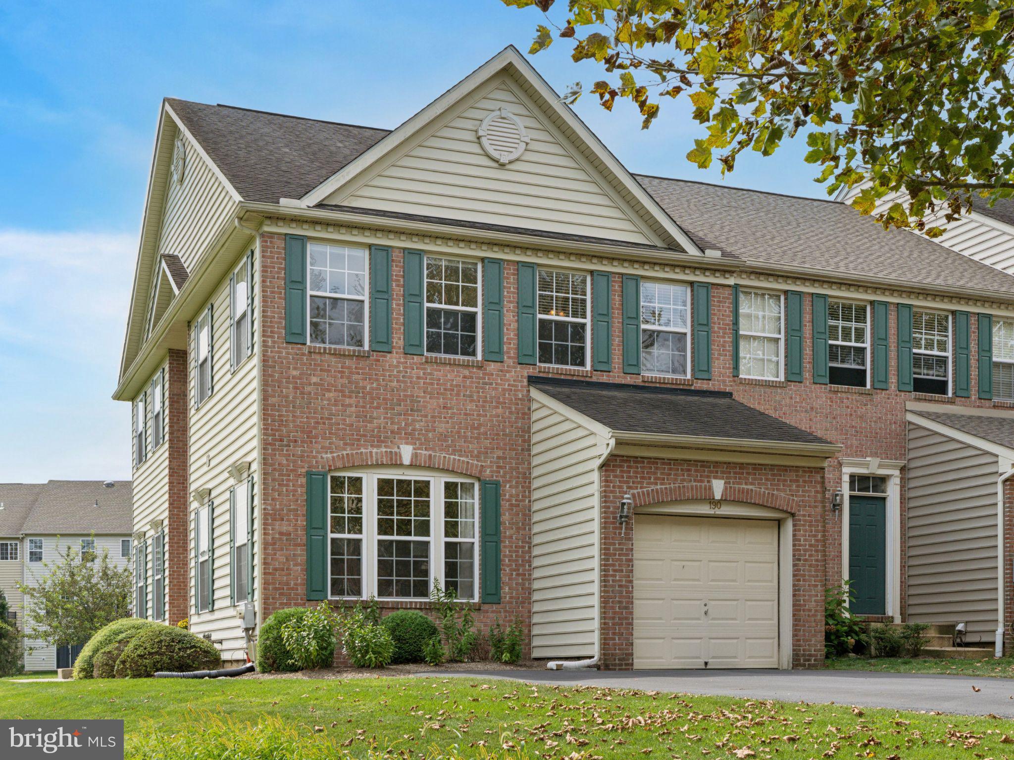 Welcome to 190 Penns Manor Drive, a beautifully updated end-unit townhome in the highly desirable Penns Manor community of Kennett Square. Perfectly positioned with sunset views and open space, this 3-bedroom, 2.5-bath home offers a one-car garage, finished walk-out basement, and move-in-ready convenience. The main level greets you with a dramatic two-story foyer and an abundance of natural light from walls of windows that showcase the private setting. The dining room centers the space with a striking gas fireplace and flows easily into the eat-in kitchen, complete with granite countertops, stainless steel appliances, a large island, and access to the new Trex deck (2023)—ideal for entertaining. A spacious family room, powder room, and laundry with garage entry complete this level. Upstairs, retreat to the primary suite with vaulted ceilings, a walk-in closet, and a luxurious bath featuring double vanity, soaking tub, and a newly updated glass shower. Two additional bedrooms and a full hall bath offer plenty of room for family or guests. The fully finished walk-out basement expands your lifestyle options with flexible space for a gym, office, or media room, plus extra storage. Additional highlights include a brand-new HVAC system (2023), low HOA fees, and a prime location close to downtown Kennett Square’s restaurants and shops, with easy access to Routes 1 and 202, West Chester, and Wilmington. Stylish, spacious, and turnkey—190 Penns Manor Drive is ready to welcome you home.