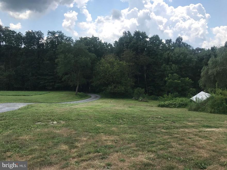 INCREDIBLE DEAL - Great savings in cost AND time when the lot you build on includes the well and septic already!  Enjoy this creek front property, on a country road, near state parks and Appalachian Trail!  Start building sooner! Walk out basement possible with the gently sloped lot!  So much potential!